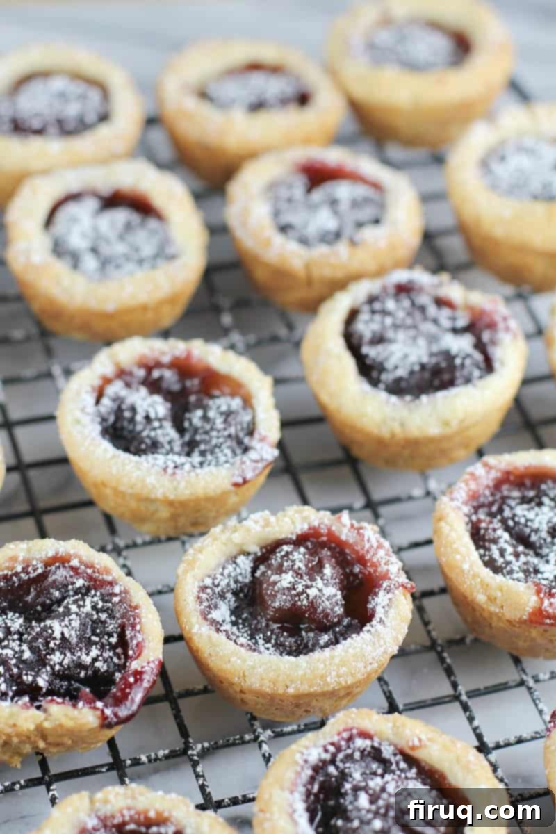 Velvet Cherry Cookie Tarts 7 lots of cooked gourmet christmas cookies, on a marble surface