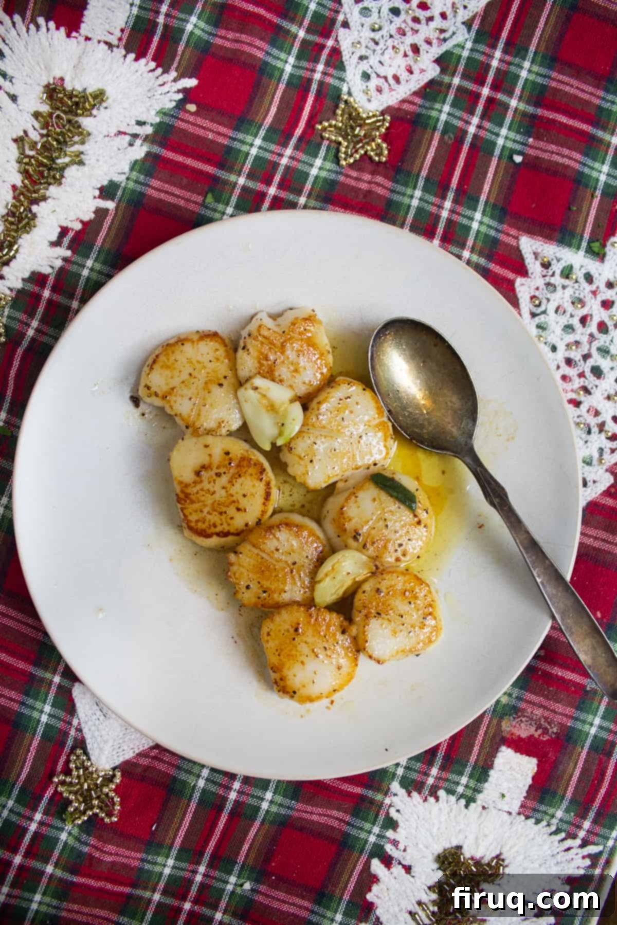 Christmas Eve's Seven Fishes Feast 4 Seared scallops on a plate.