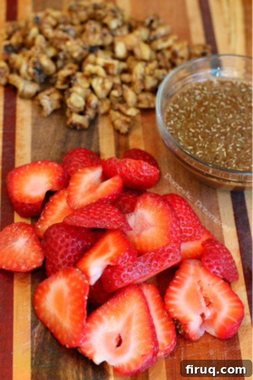 Strawberry Salad with Candied Walnuts Fresh and vibrant Strawberry Salad with Lightly Candied Walnuts and Rosemary Balsamic Dressing, a perfect summer dish.