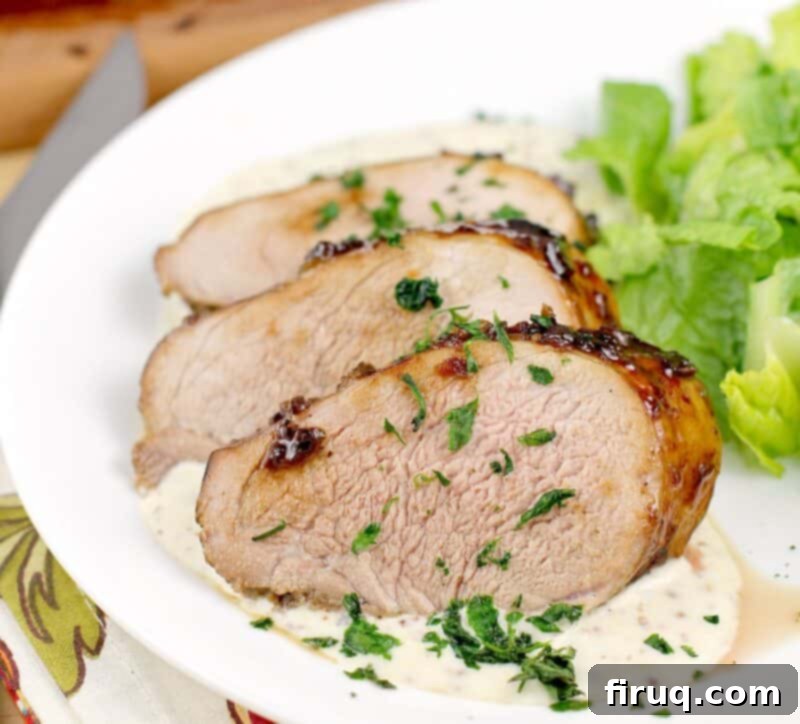 Bourbon-Glazed Pork Medallions with Zesty Mustard Sauce 12 plated recipe showing doneness of the meat, on white plate