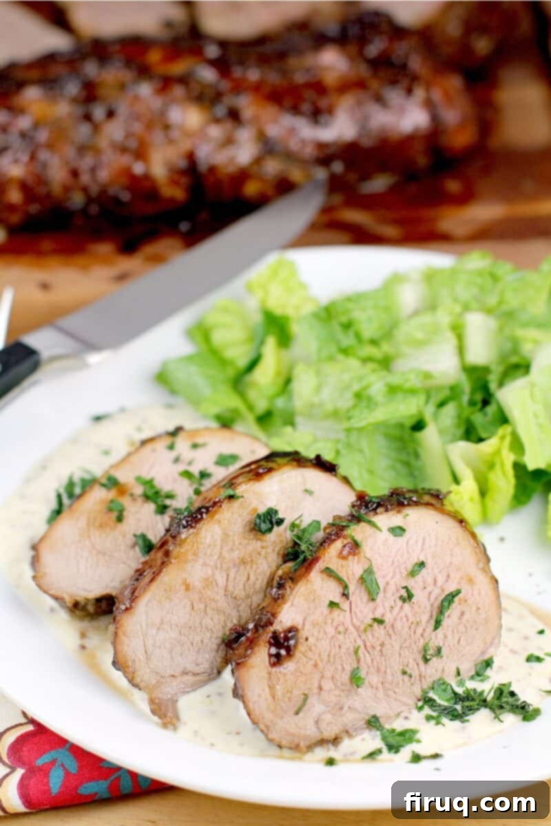 Bourbon-Glazed Pork Medallions with Zesty Mustard Sauce 13 plated recipe, knife and pork roast in the background