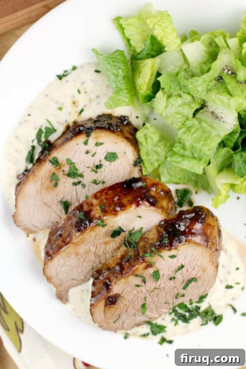 Bourbon-Glazed Pork Medallions with Zesty Mustard Sauce 3 plated recipe with salad on white plate