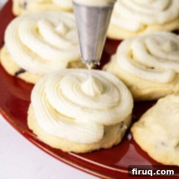 Citrus Cranberry Shortbread Morsels 10 Cookies being frosted with a piping bag.