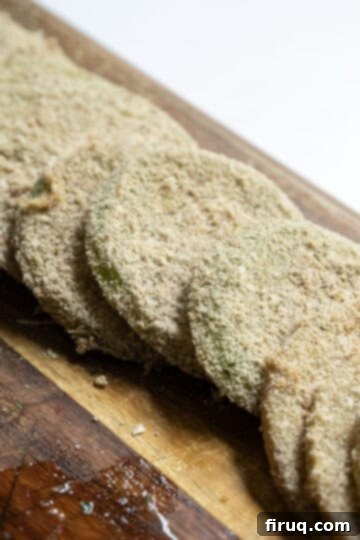 Crispy Italian Fried Green Tomatoes 6 Green tomato slices perfectly coated in Italian breading, ready for frying.