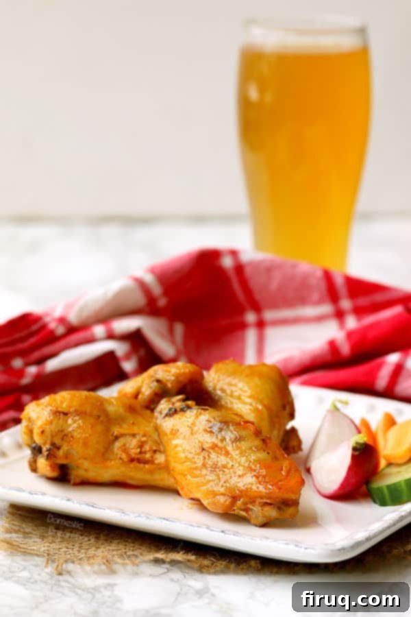 A plate of freshly baked hot wings with dips. Crispy Baked Hot Wings - Domestic Dreamboat #glutenfree #chickenwings #hotwings