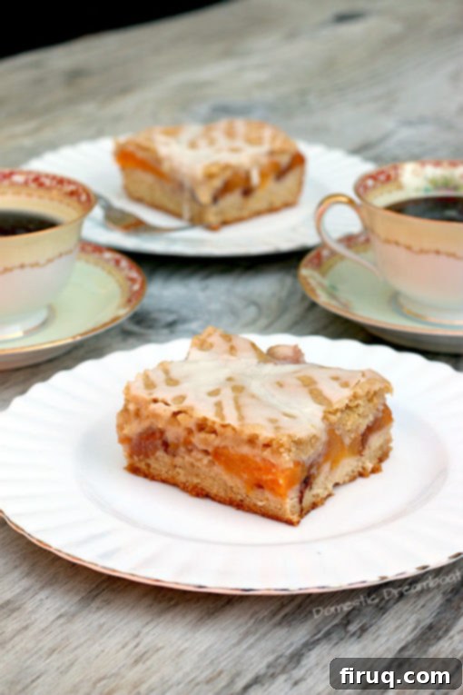 Peach Pie Bars with Glaze Sliced Peach Pie Bars showing the layers