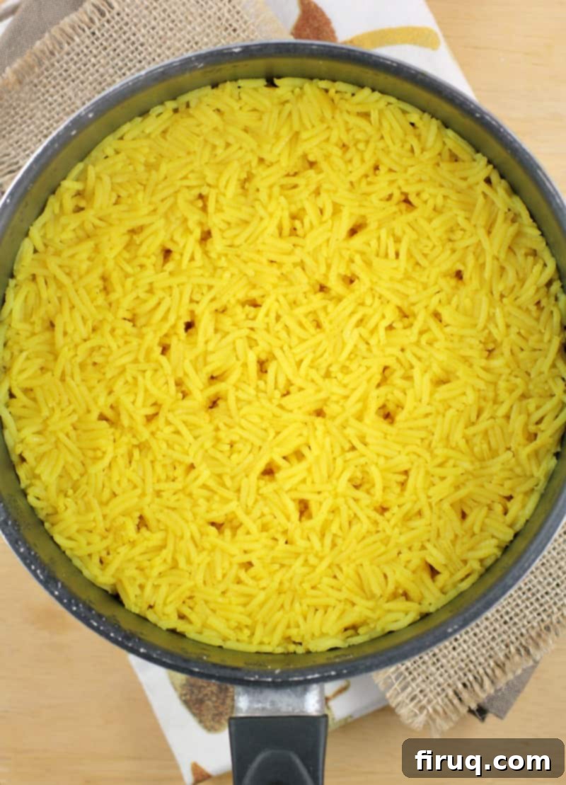 Golden Turmeric Pea Rice 4 cooked termieric rice in a pot
