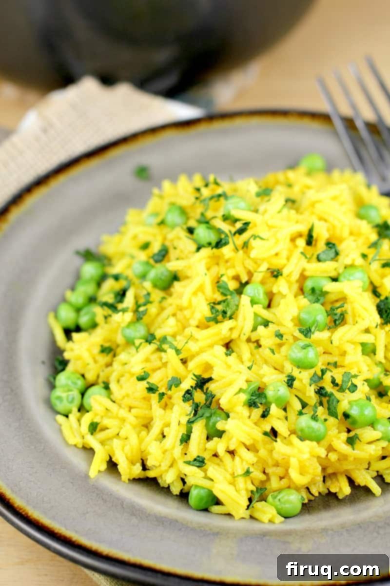 Golden Turmeric Pea Rice 10 turmeric yellow rice on a grey plate