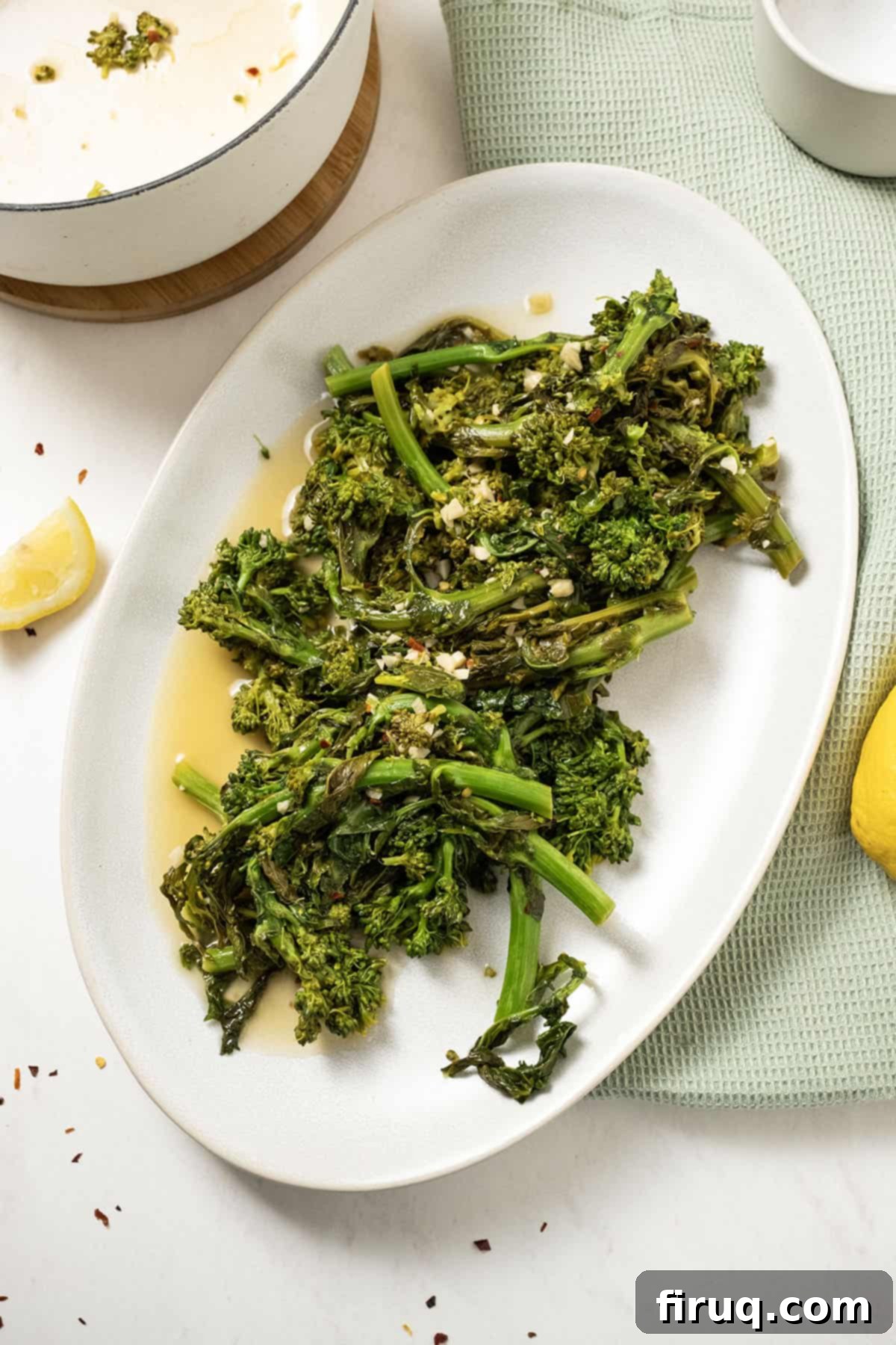 Vibrant Garlic Rapini 2 finished sauteed rapini with garlic and lemon served on a white plate