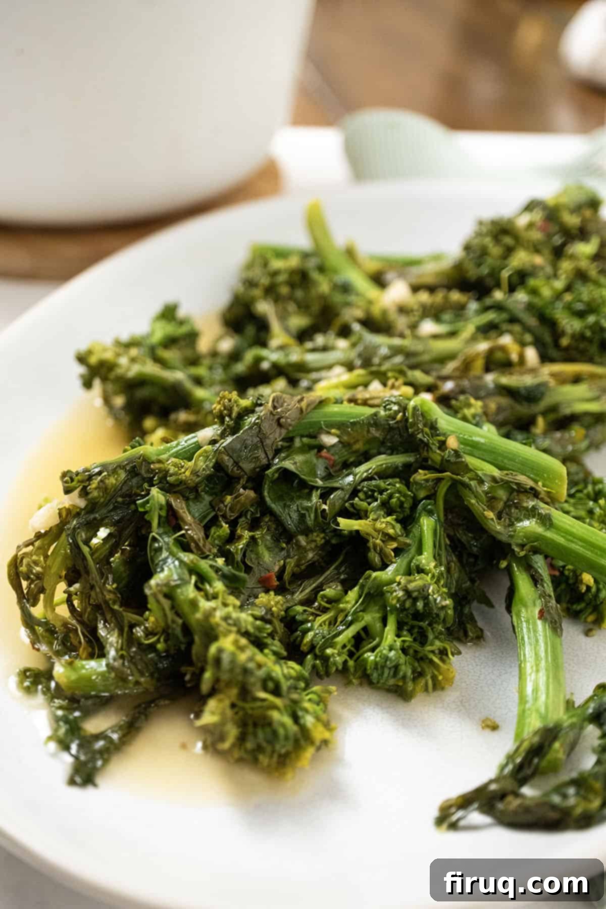 Vibrant Garlic Rapini 8 finished sauteed rapini with garlic and lemon served beautifully on a white plate as a side dish