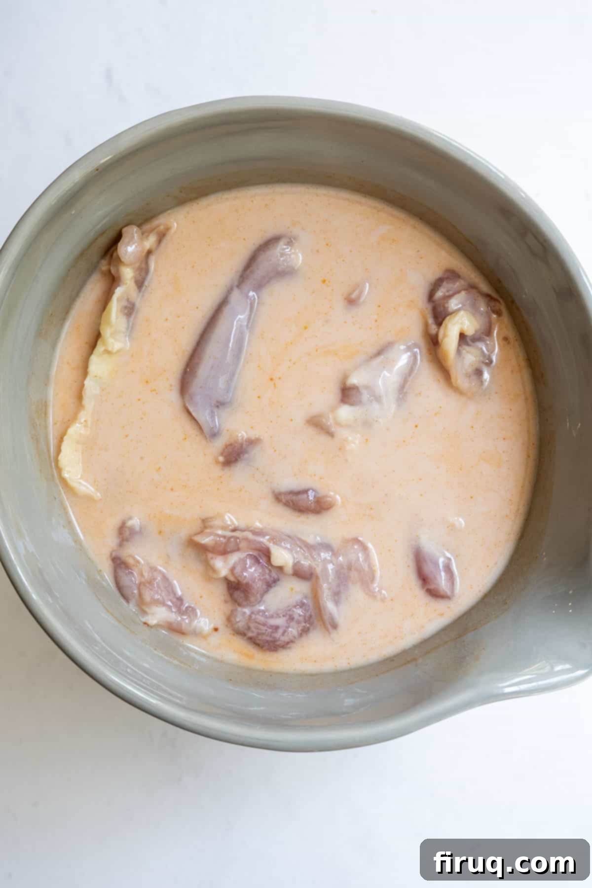 Sweet Heat Chicken Sandwich 4 fried chicken marinating in buttermilk