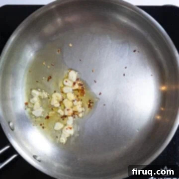 Flavorful Artichoke Pesto Pasta 6 sauteing garlic and crushed red pepper
