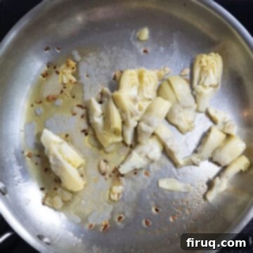 Flavorful Artichoke Pesto Pasta 7 chopped artichokes added to the pan