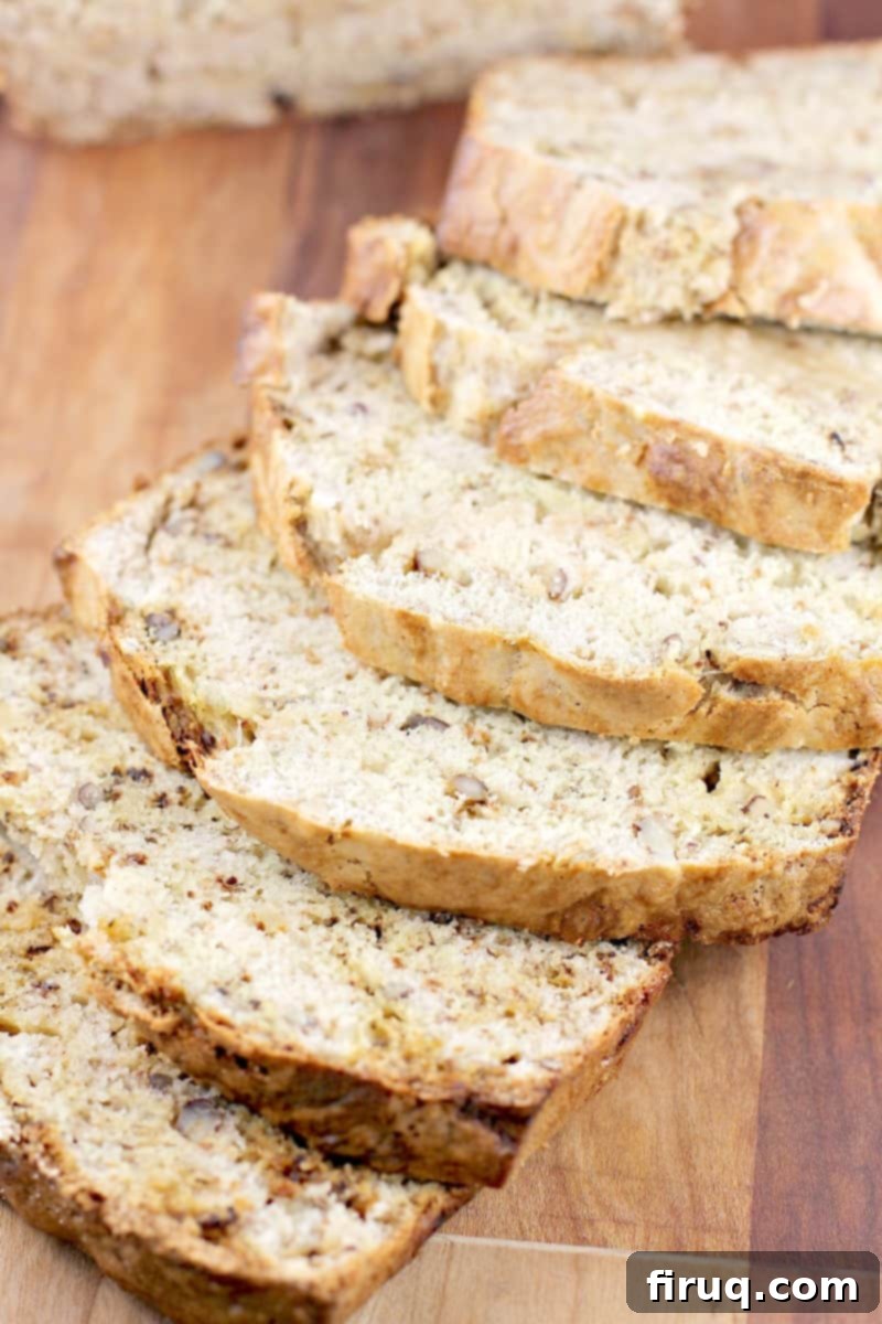 Heirloom Banana Bread 9 sliced banana bread on wood board