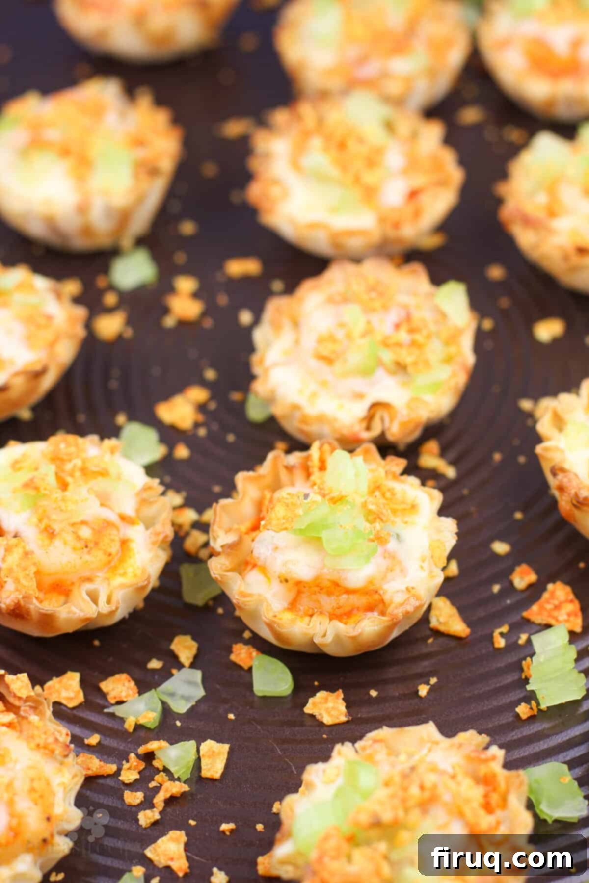 Buffalo Shrimp Poppers 3 filled mini phyllo cups on bake sheet