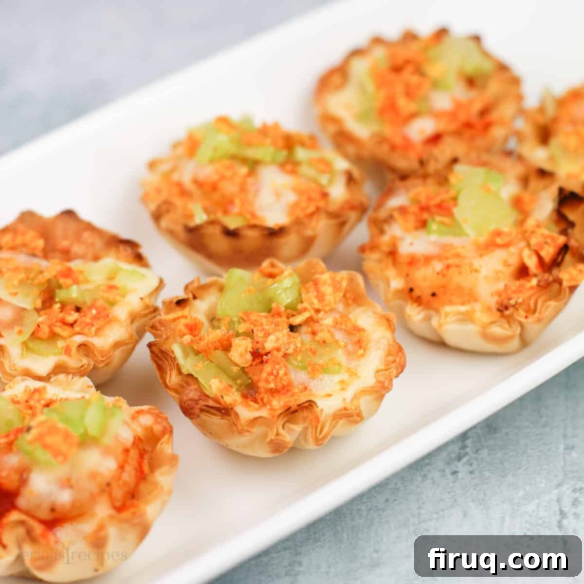 Buffalo Shrimp Poppers 7 buffalo shrimp bites on white dish
