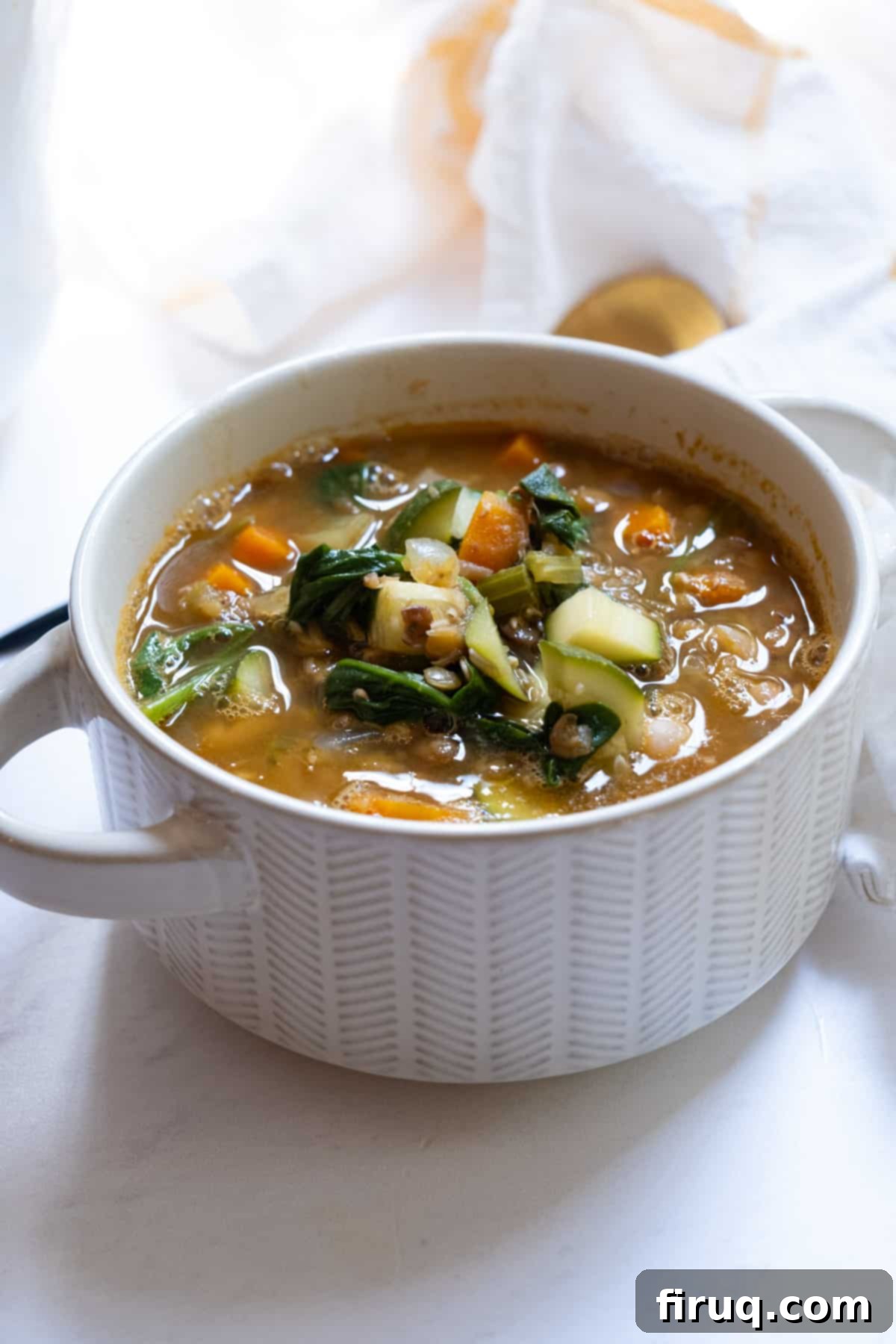 Hearty White Bean Lentil Soup 13 White bean and lentil soup in a bowl.