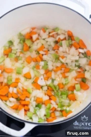 Hearty White Bean Lentil Soup 4 sauteing the carrots, celery, and onion.