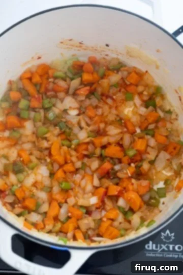 Hearty White Bean Lentil Soup 6 tomato paste caramelizing.