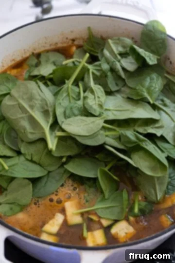 Hearty White Bean Lentil Soup 10 Spinach added to the soup.