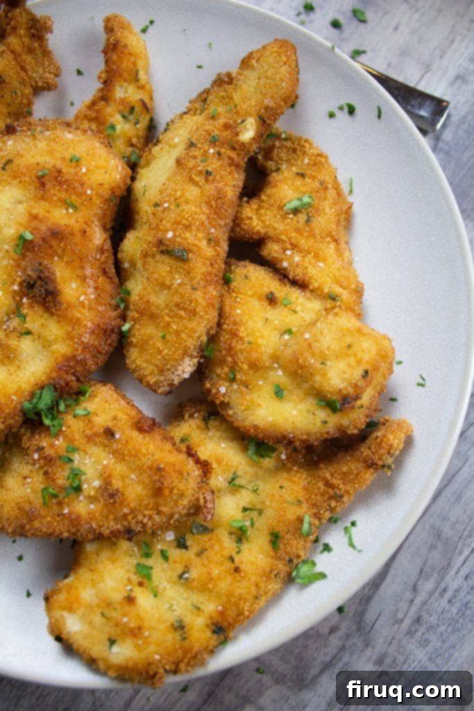 Classic Italian Dishes You Need to Master 2 Crispy Italian Chicken Cutlets golden brown and piled high