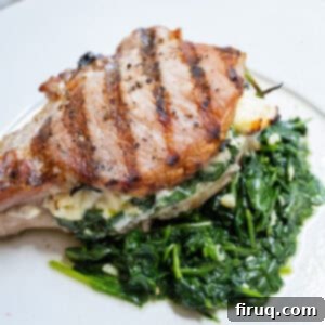 The Ultimate Grilled Stuffed Pork Chops 11 A grilled pork chop stuffed with feta and sauteed spinach and garlic served on more sauteed spinach.