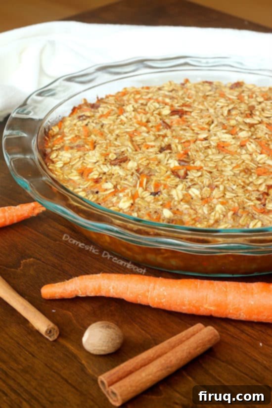 Carrot Cake Baked Oatmeal with Cream Cheese Frosting 2 Carrot Cake Baked Oatmeal in a glass baking dish.