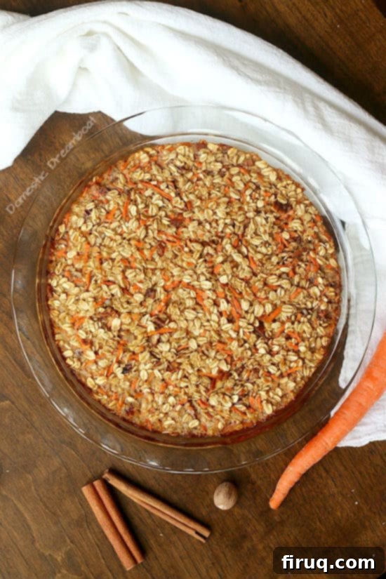 Carrot Cake Baked Oatmeal with Cream Cheese Frosting 3 Carrot Cake Baked Oatmeal in a glass baking dish.