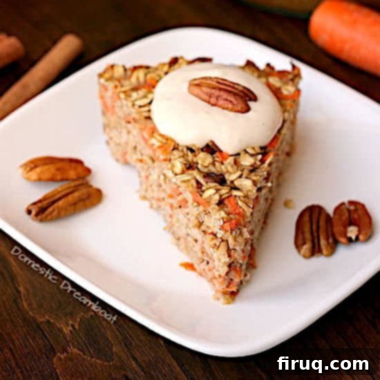 Carrot Cake Baked Oatmeal with Cream Cheese Frosting 6 A square image of Carrot Cake Baked Oatmeal with Cream Cheese Topping, garnished with pecans.