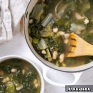 Hearty Escarole and Bean Soup 10 A Dutch oven filled with a heartwarming Escarole and Bean Soup, with a smaller bowl ready for serving. The vibrant greens and creamy beans are prominent, suggesting a comforting and wholesome dish.