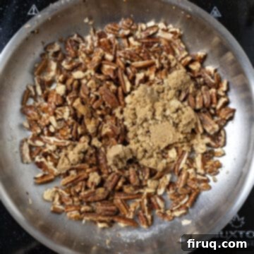 Decadent Bourbon Candied Pecans 5 Combining pecans with brown sugar in a pan.