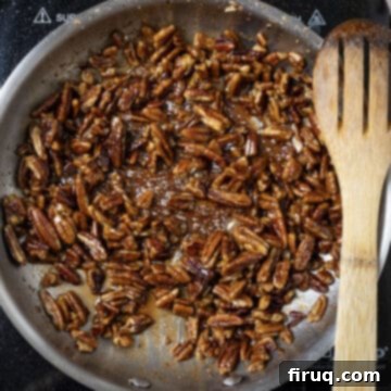 Decadent Bourbon Candied Pecans 7 Caramelizing sugar to pecans in the pan.