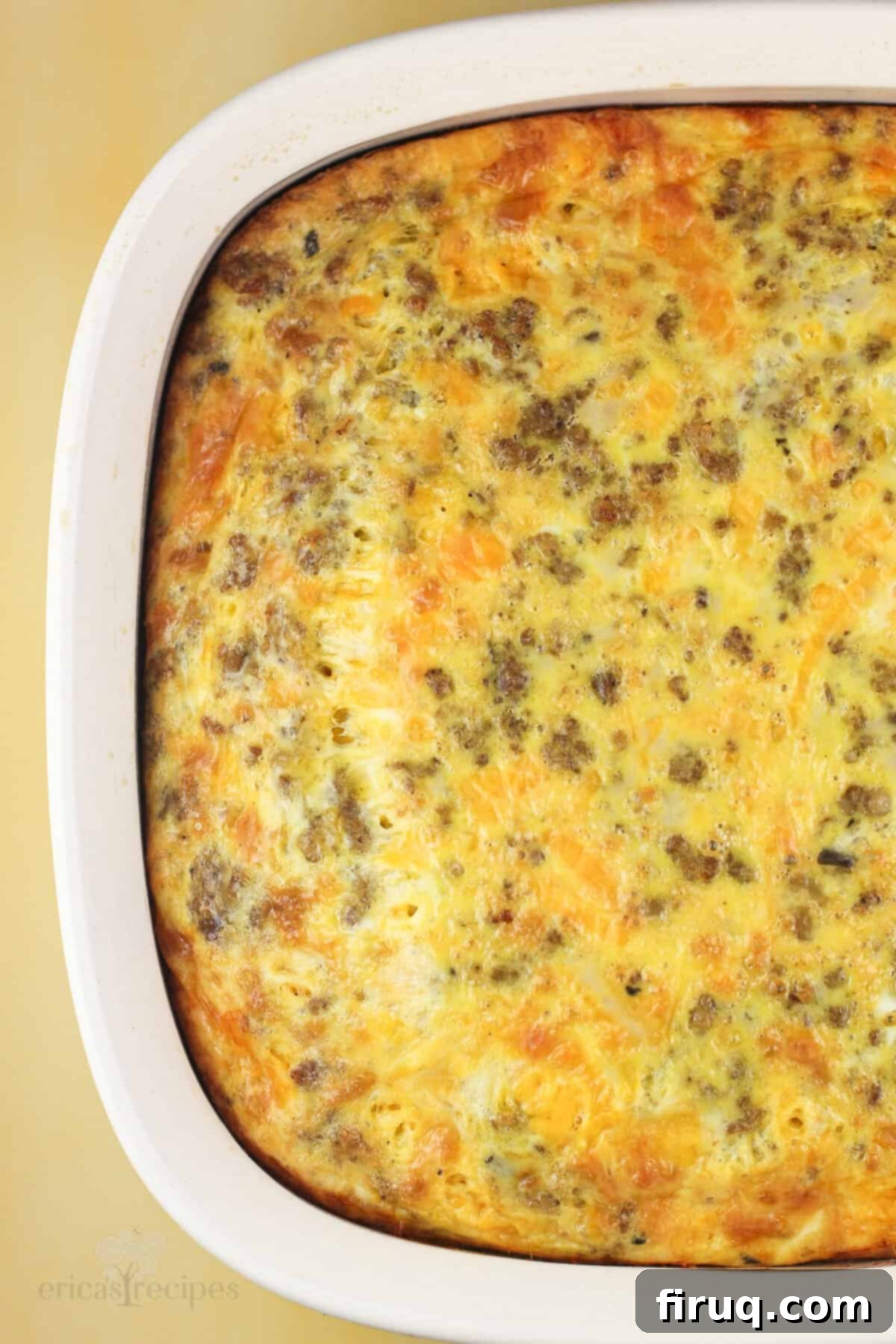 Hearty Sausage & Vegetable Bake 6 Top-down view of a fully baked, golden-brown sausage egg and cheese casserole, ready to be served.