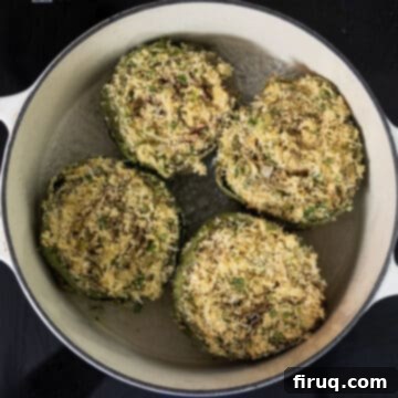 Simple Italian Stuffed Artichokes 8 Stuffed artichokes in a dutch oven with a little bit of water.