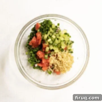 The Olympian Chicken Burger 5 Tabbouleh ingredients mixed together in a bowl.