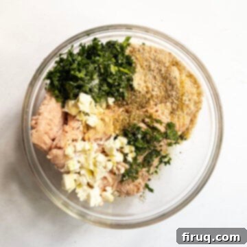 The Olympian Chicken Burger 7 Ground chicken mixed with ingredients to make the chicken burger in a bowl.