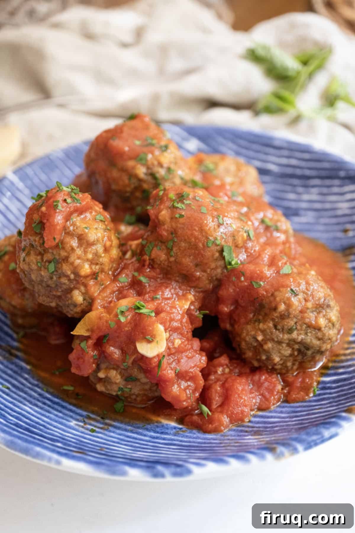 To Peel or Not to Peel Potatoes 5 Meatballs covered in tomato sauce in a bowl.