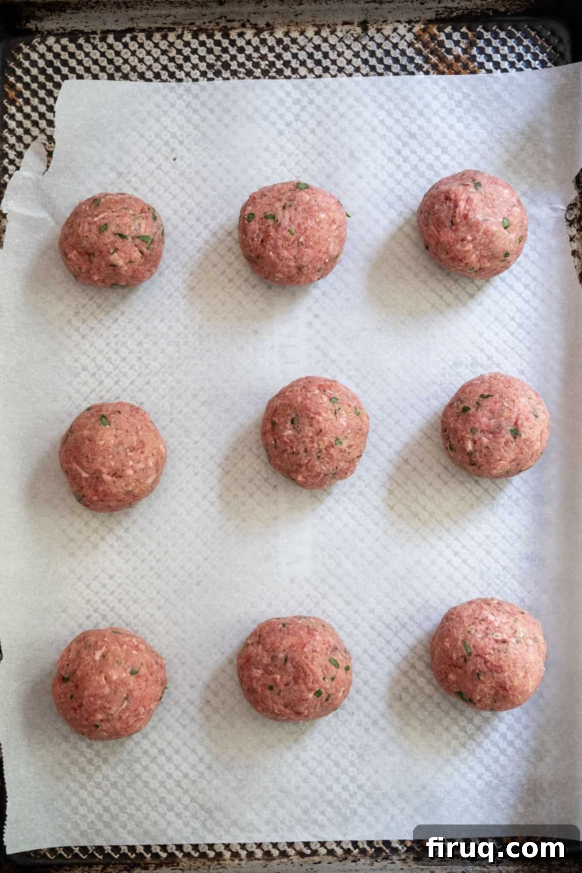 To Peel or Not to Peel Potatoes 7 Raw meatballs on a baking sheet.