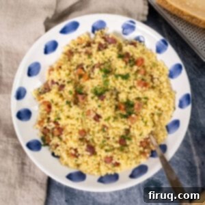 Classic Pastina Carbonara 12 Creamy Pastina Carbonara in a bowl, garnished with crispy pancetta and fresh parsley.