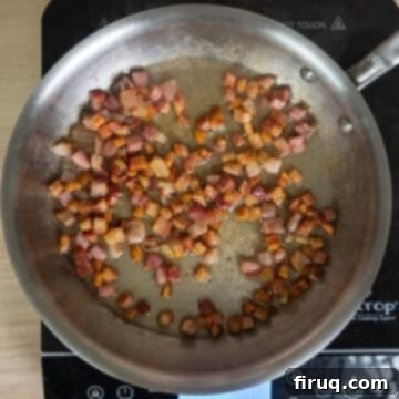 Classic Pastina Carbonara 6 Golden brown and crispy fried pancetta in a pan, with rendered fat.