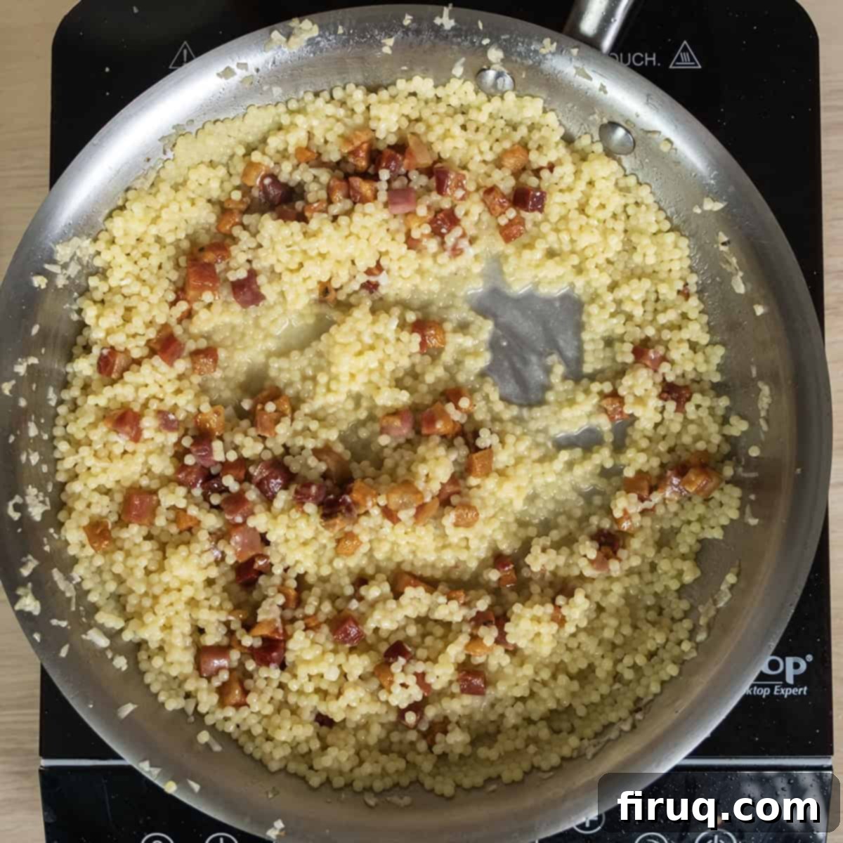 Classic Pastina Carbonara 10 Crispy pancetta and freshly grated Parmigiano cheese being stirred into the creamy pastina.