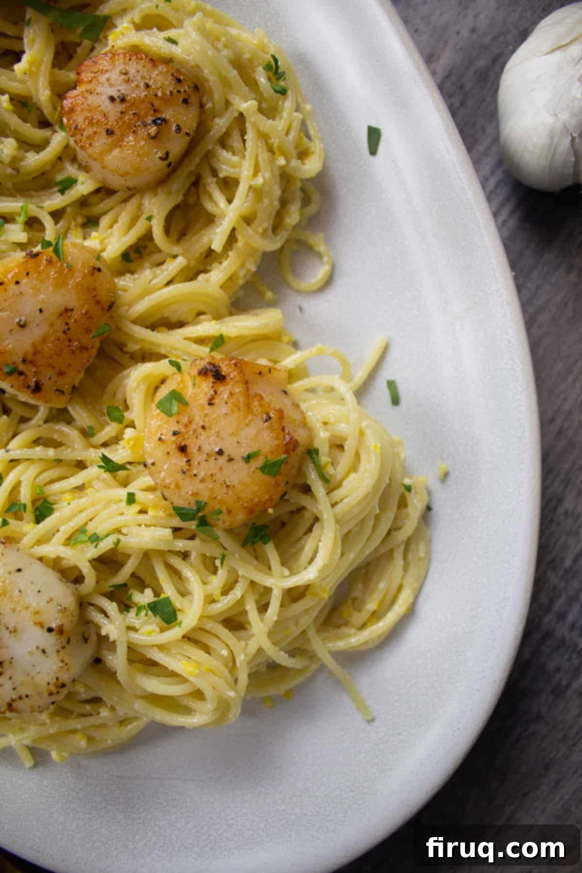 Bright Lemon Pesto Spaghetti with Pan-Seared Scallops 2 Lemon pesto spaghetti with scallops and fresh parsley, garnished for a vibrant meal