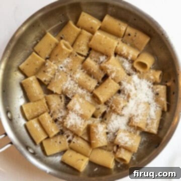 Roman Guanciale Pasta 11 Pecorino romano added to the pan to continue tossing.