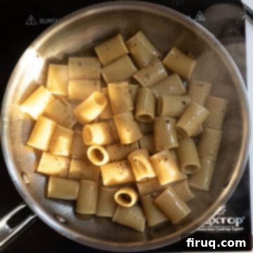 Roman Guanciale Pasta 9 Emulsifying the sauce by tossing pasta consistently.