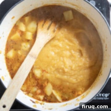 Velvety Potato and Onion Embrace 10 The blended half of the soup transferred back to the pot.