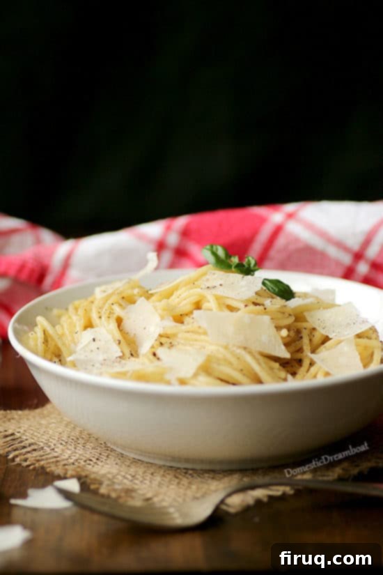 Best Cheese for Cacio e Pepe Freshly grated Parmesan cheese for Cacio e Pepe, emphasizing ingredient quality