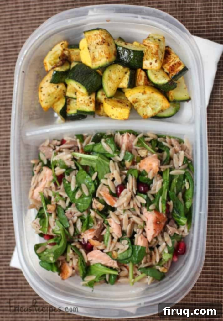 Overhead shot of Orzo Power Salad with Salmon, Walnuts, and Greens, ready for serving