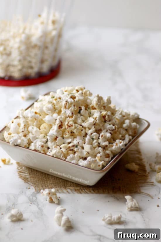 Miso Butter Popcorn A bowl of Miso Butter Popcorn with a close-up on the individual kernels coated in the savory butter, ready to be enjoyed.