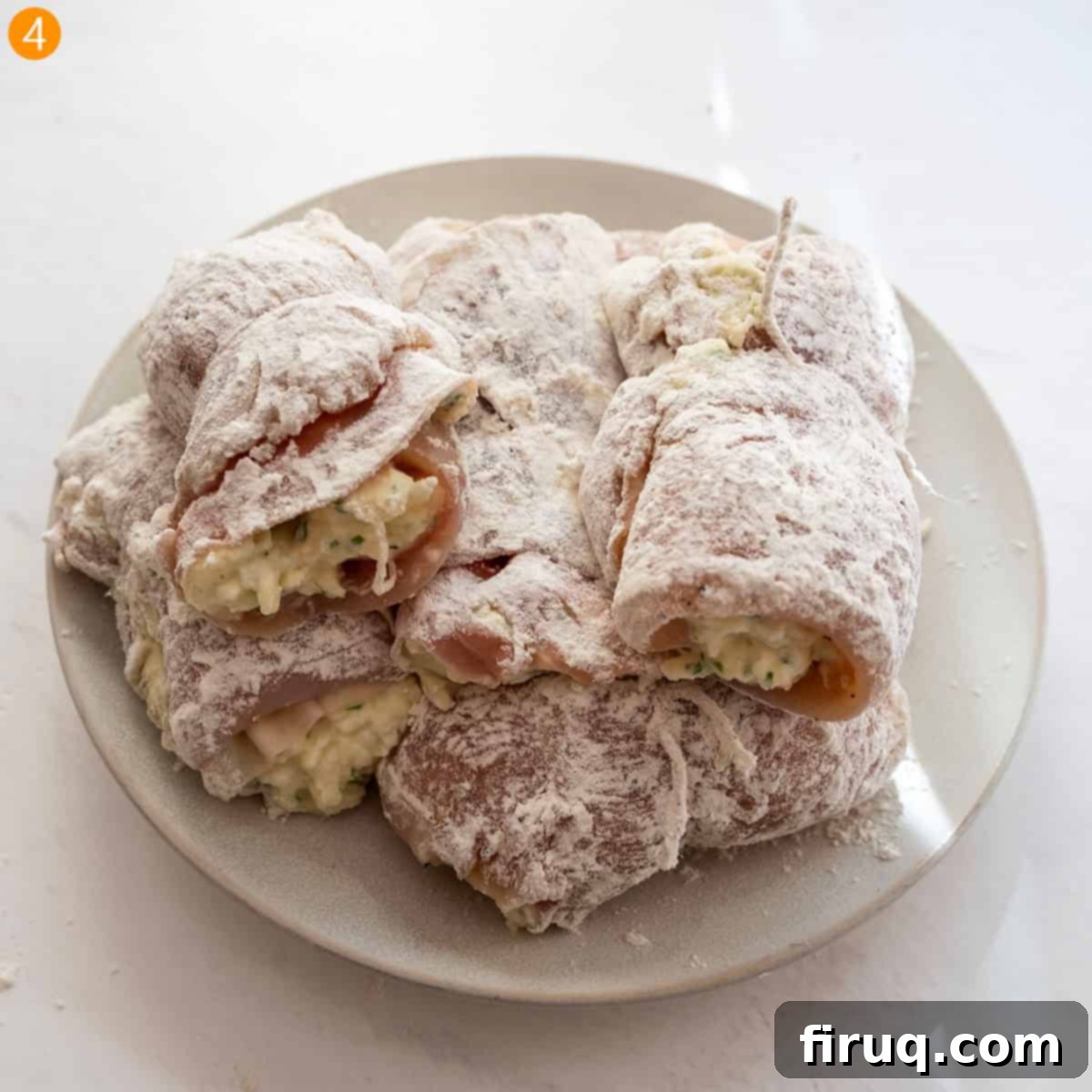 Chicken Rollatini 7 Dredge the chicken rollatini in flour.