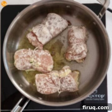 Chicken Rollatini 8 Frying the chicken rollatini in a pan.